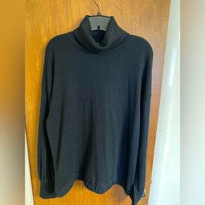 Deep black lady’s turtleneck sweater, new with tags, size XL.